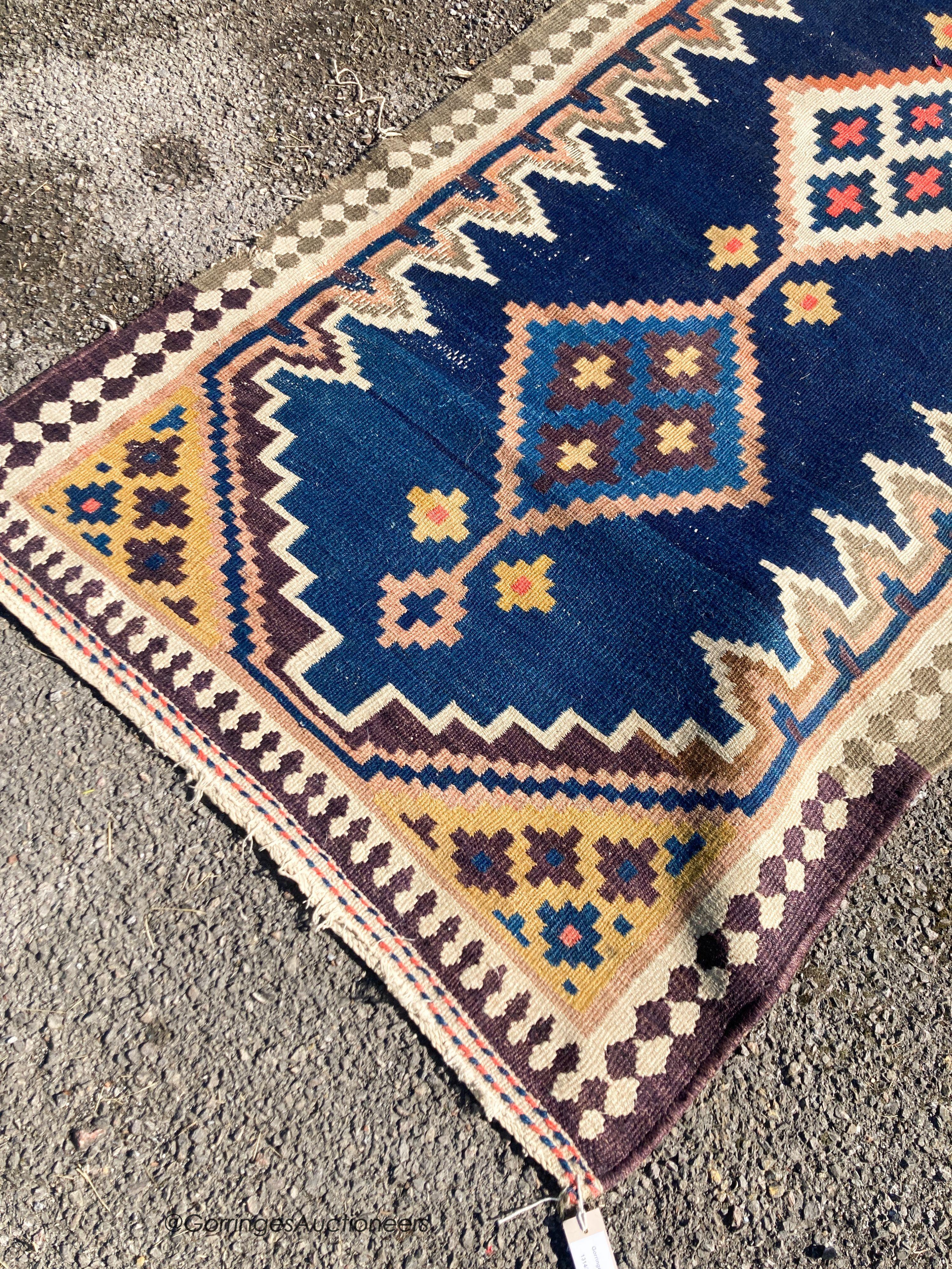 A long Eastern flatweave Kelim runner, 540 x 108cm